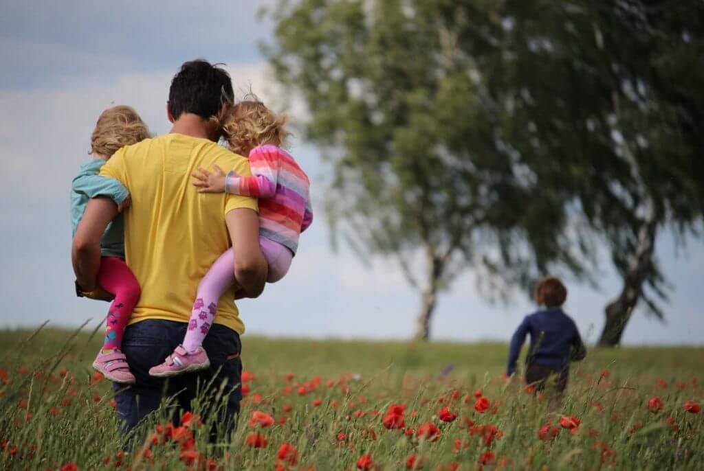 Dad holding children