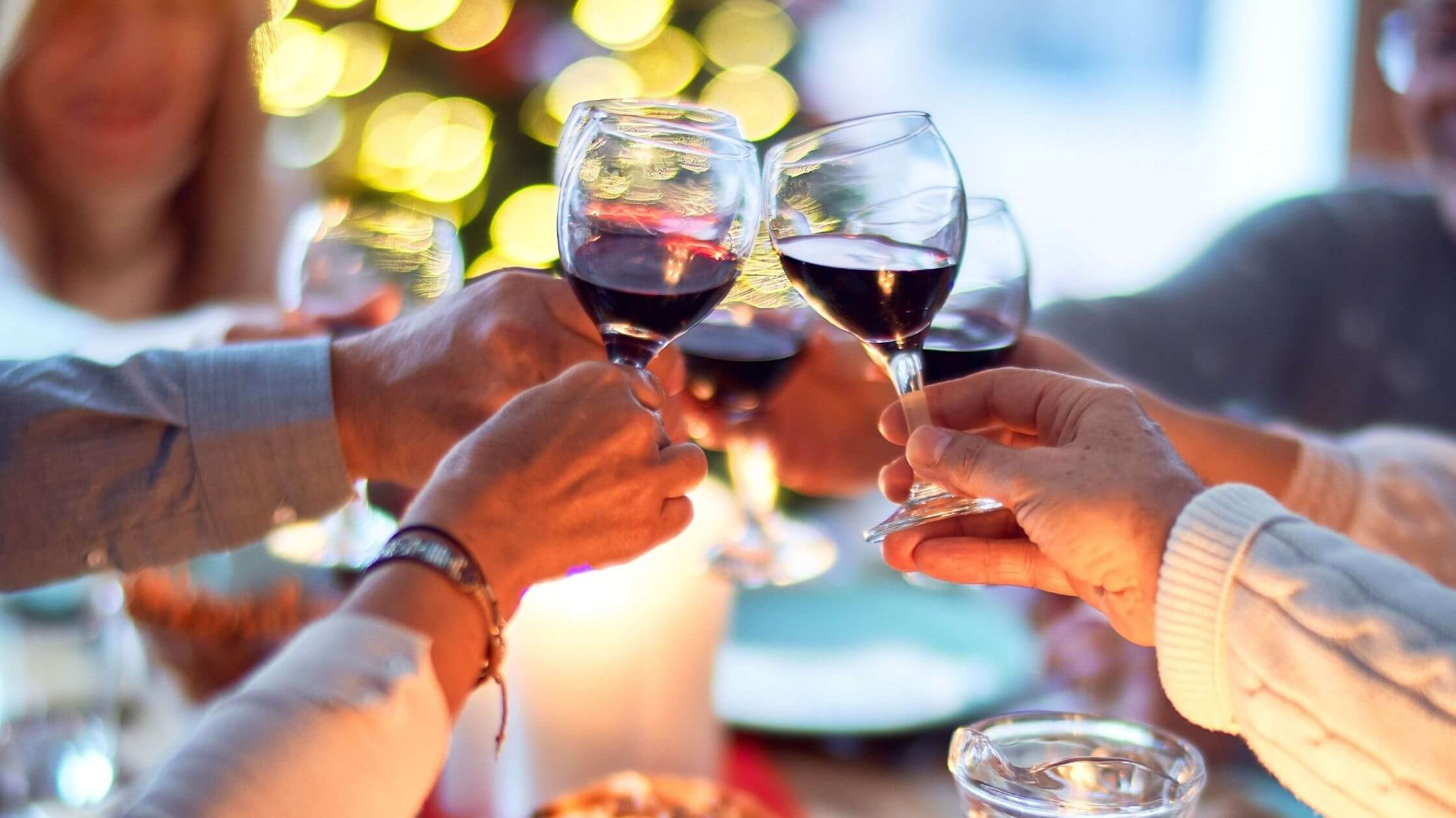 People Clinking Wine Glasses Together